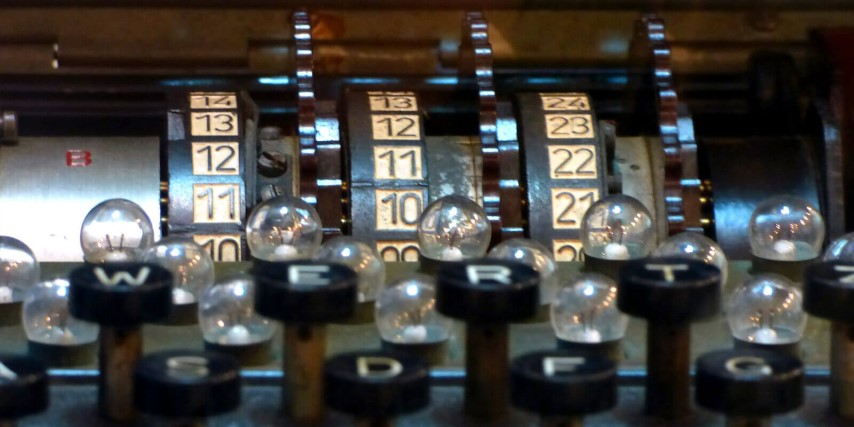 Close up of an enigma machine detailing the keyboard, lamp board and rotors used to encrypt messages during world war 2.